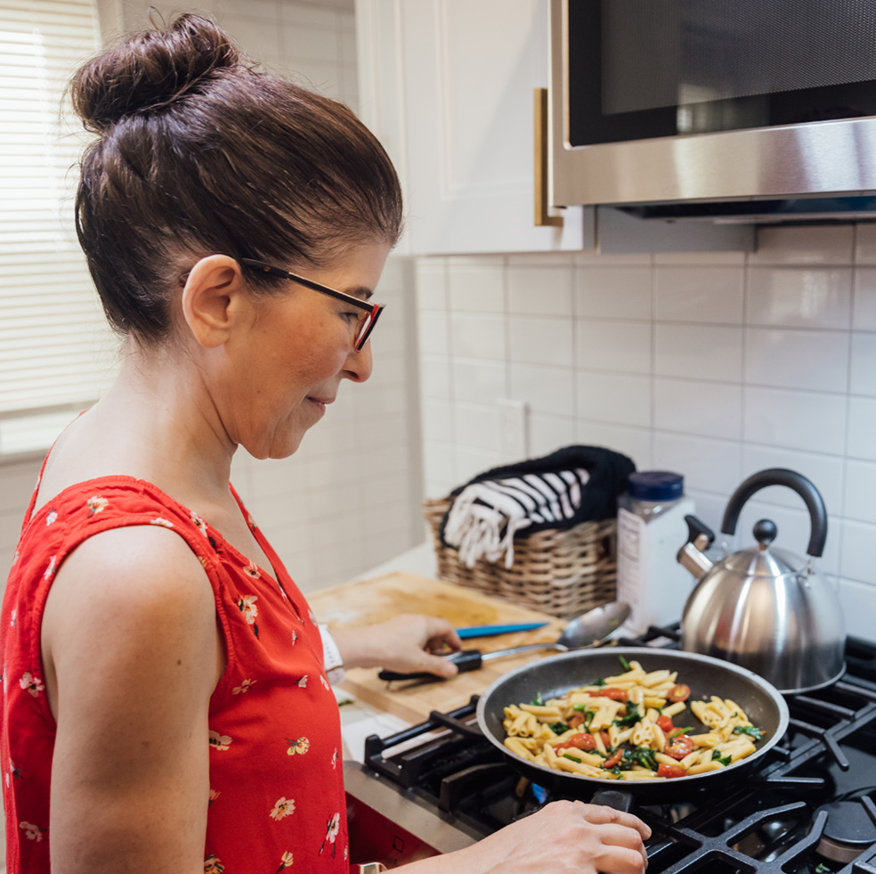 Marianne Sarcich cooking a healthy meal on her stove