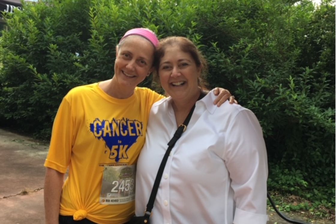 Lynn Folkman and her sister Deb after Lynn completes a 5K for cancer.